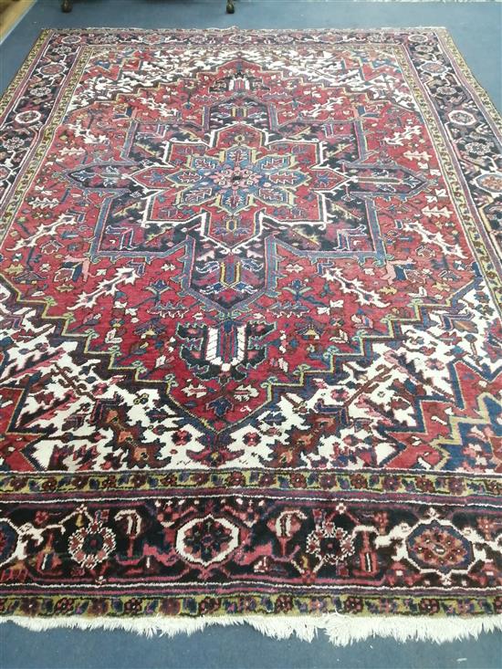 A Heriz red ground carpet 255 x 340cm